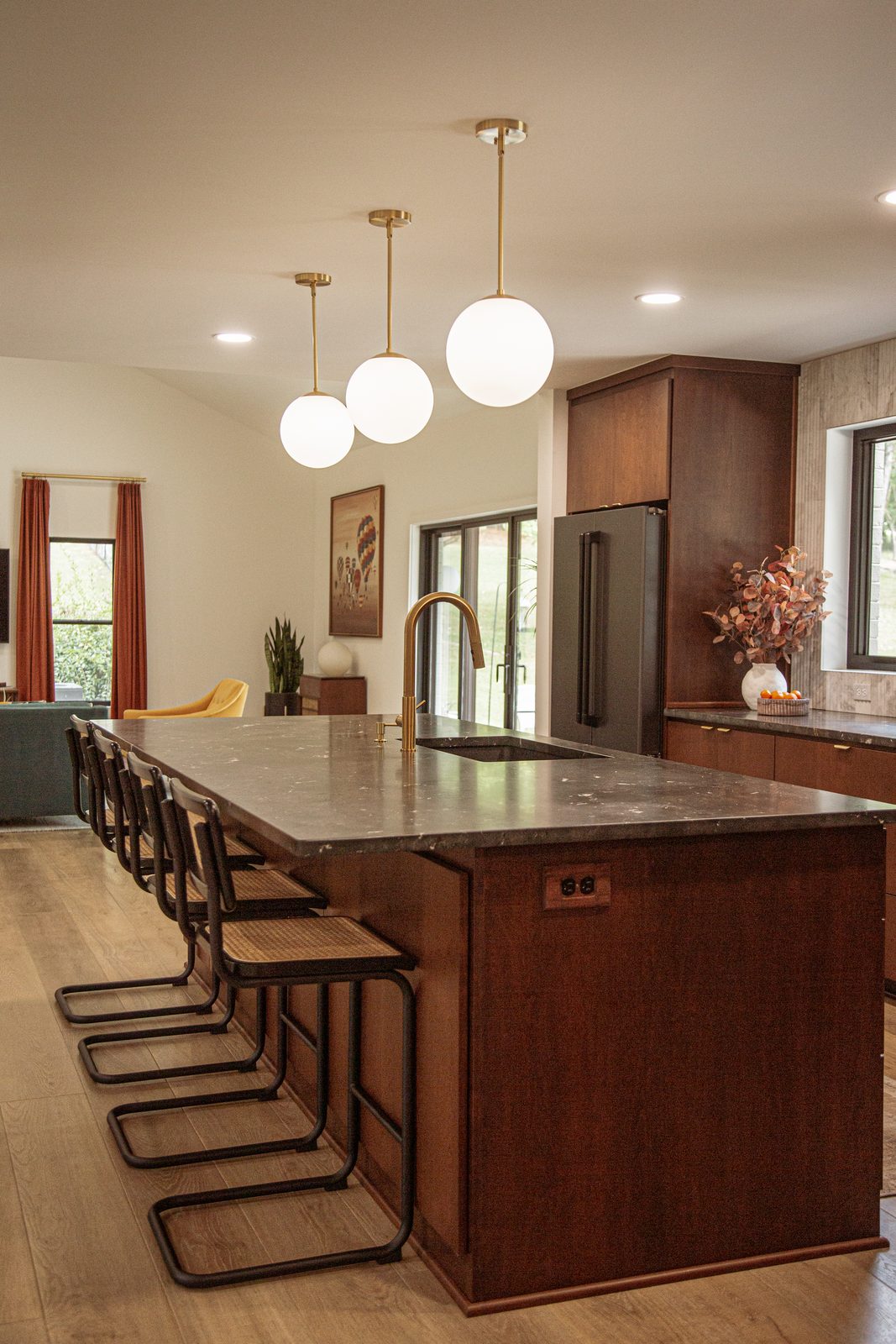 Custom walnut kitchen with marble backsplash by Lionheart Construction