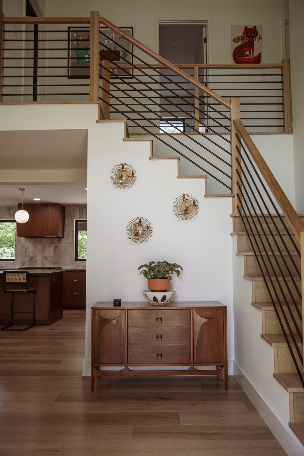 Bright entry and staircase with natural light and warm wood tones