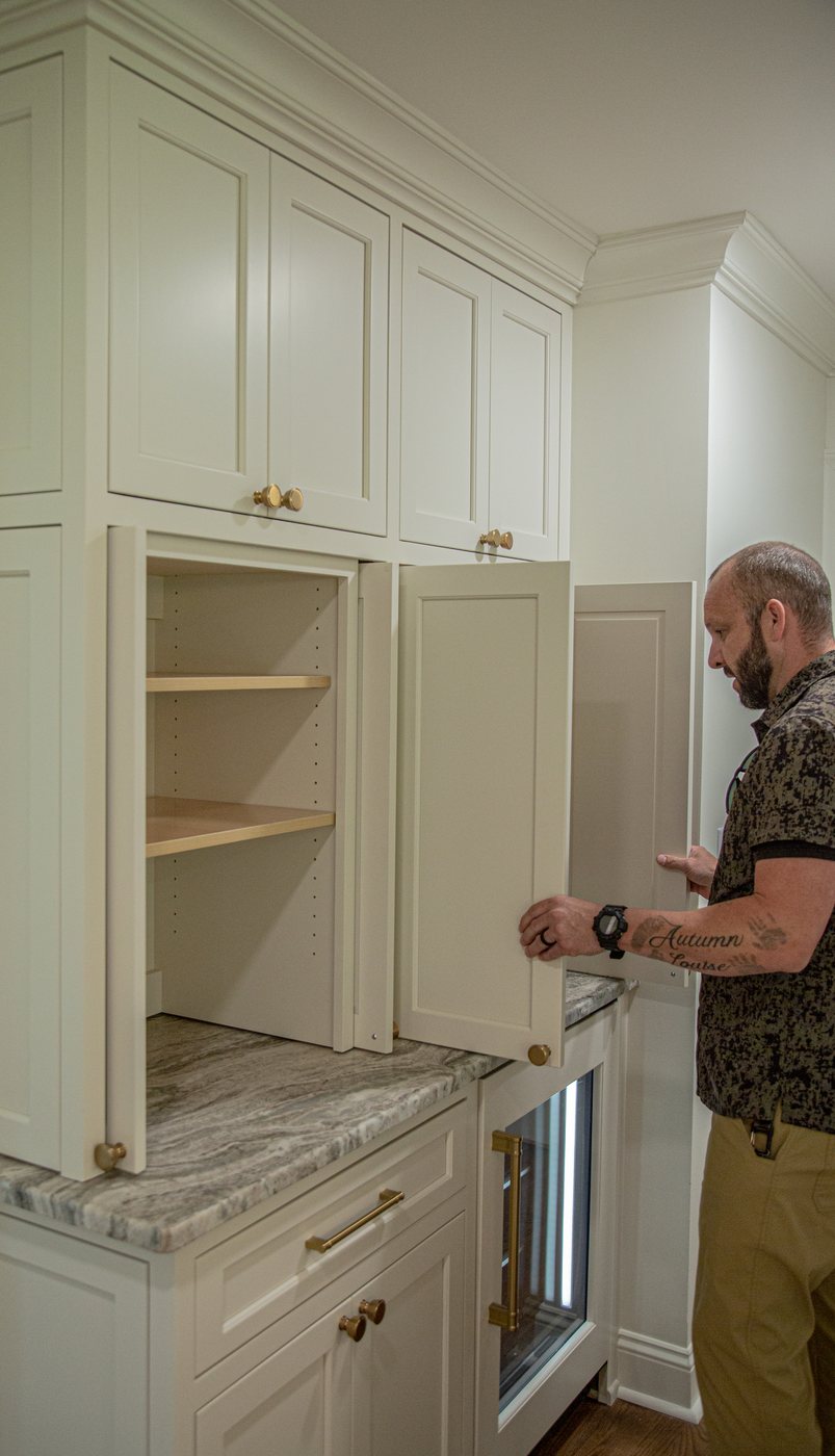Phil Sokic, owner of Lionheart Construction & Design, at work on custom cabinetry